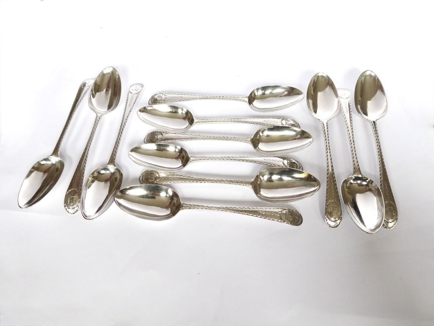 Set of 12 Irish Bright Cut Dessert Spoons C. 1777